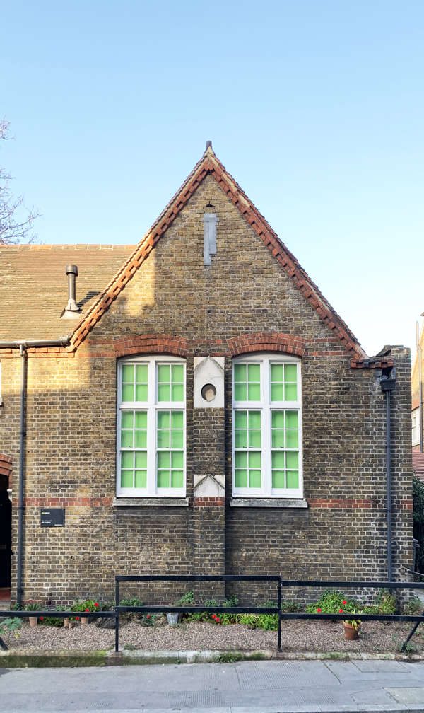 Copperfield front: Victorian yellow-brick gable building with green-paned white sash windows and terracotta roof tiles