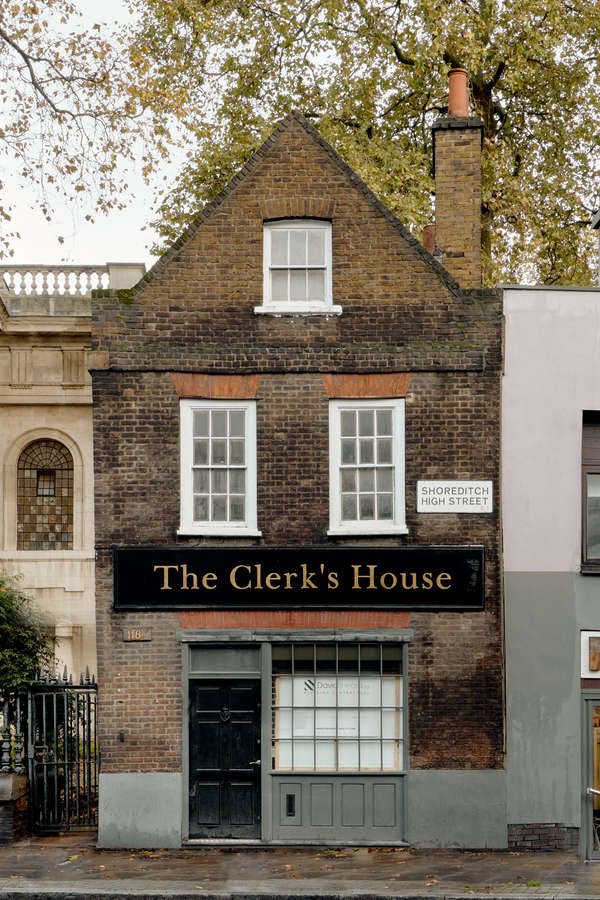 Emalin's The Clerk's House, a Georgian brick building on Shoreditch High Street, London, with white sash windows.