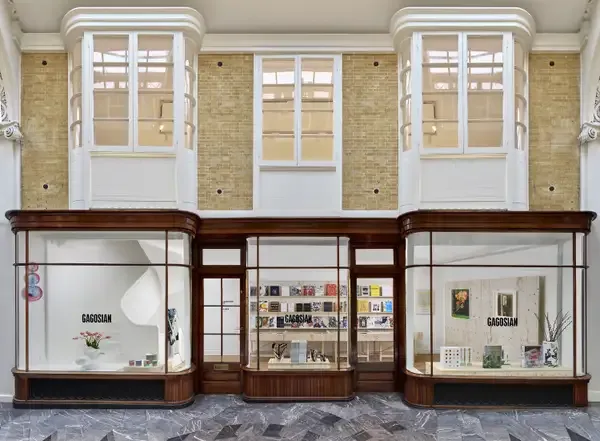 Gagosian shop storefront in Burlington Arcade, London, with wood-framed vitrines displaying art books and works