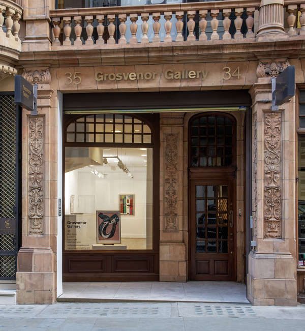 Grosvenor Gallery entrance at 34-35 with ornate terracotta facade, glass storefront and artwork on display